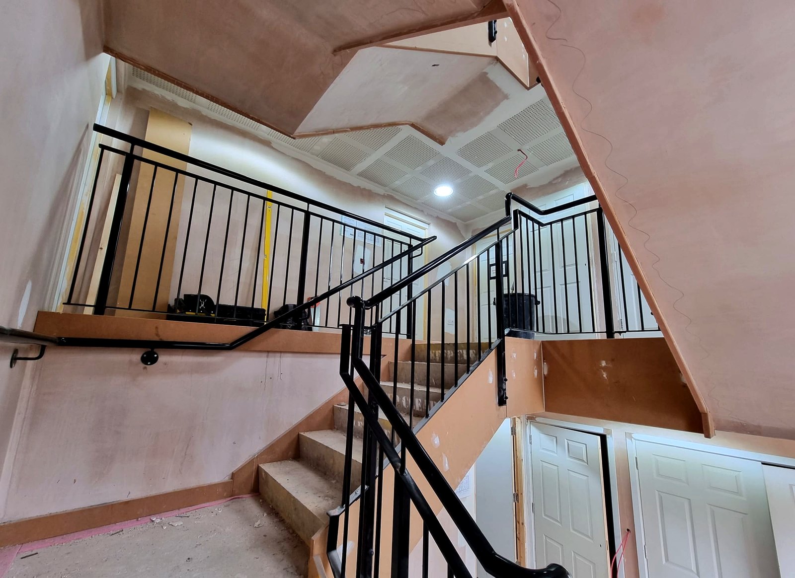 Powder-coated metal balustrade and handrails on an apartment-block communal staircase, Radlett